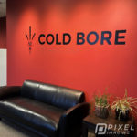 Wall Decals & Graphics Calgary - A newly insalled wall graphic bearing the text "COLD BORE" at a Calgary Business.